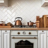 kitchen-interior-with-golden-detailed-furniture_23-2148848667